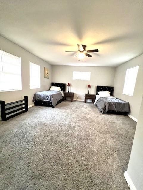 bedroom featuring ceiling fan and carpet