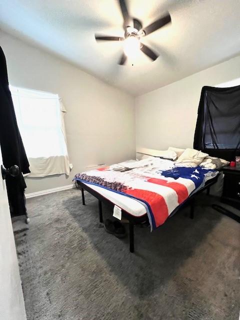 carpeted bedroom featuring ceiling fan