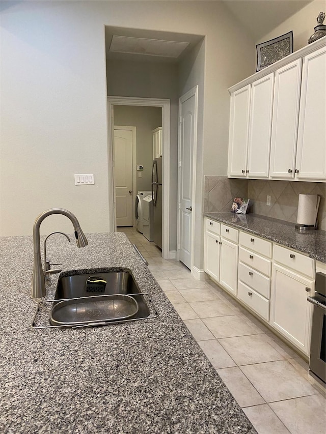 kitchen featuring sink, white cabinets, and appliances with stainless steel finishes