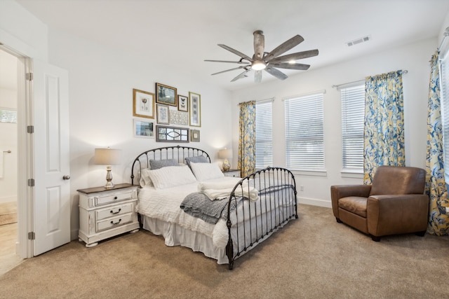 bedroom featuring ceiling fan and light colored carpet