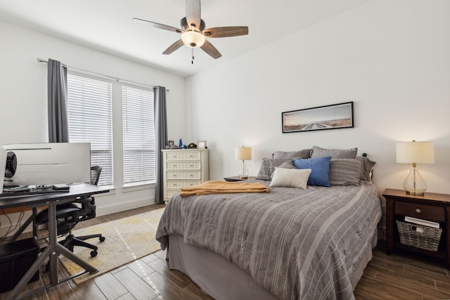 bedroom with ceiling fan and hardwood / wood-style flooring