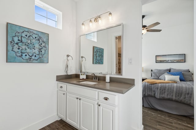 bathroom with hardwood / wood-style floors, vanity, and ceiling fan