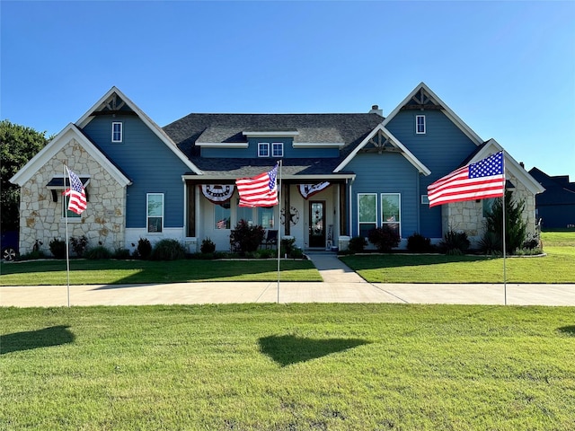 craftsman-style house with a front lawn