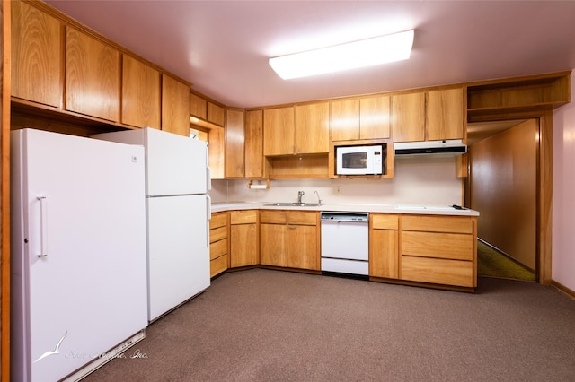 kitchen with dark colored carpet, white appliances, and sink