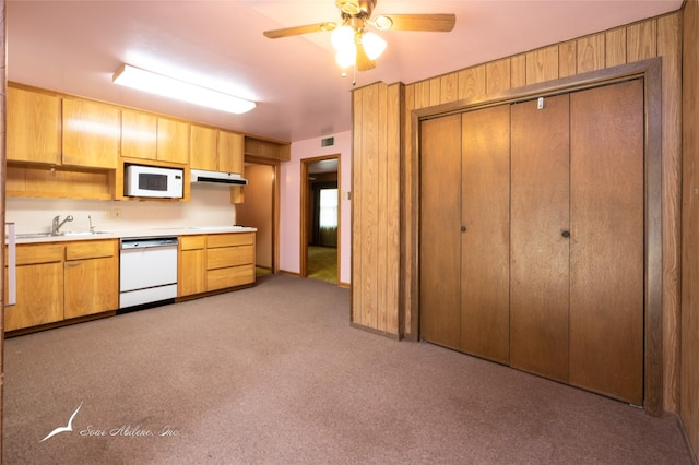 kitchen featuring light carpet, white appliances, ceiling fan, and sink