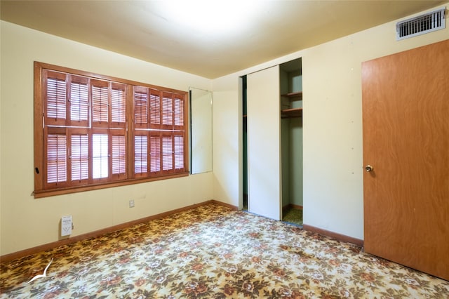 unfurnished bedroom featuring a closet