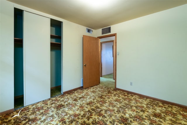 unfurnished bedroom featuring carpet flooring