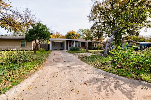 ranch-style home featuring a carport