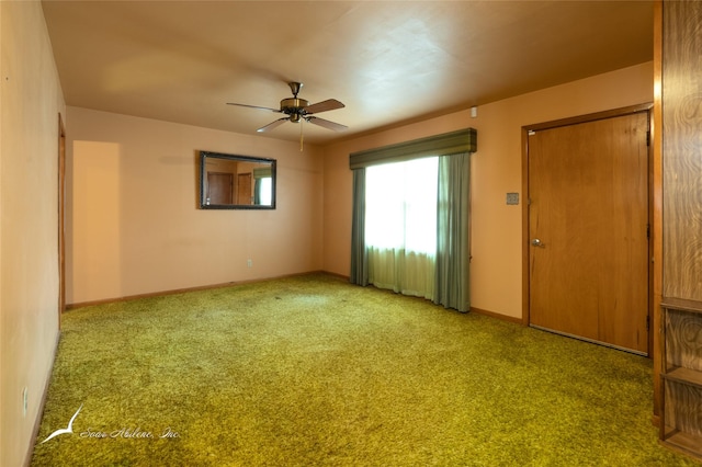 empty room with carpet and ceiling fan