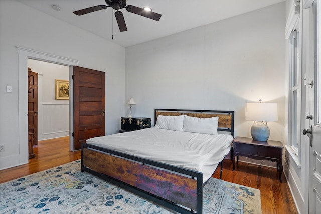 bedroom featuring ceiling fan and dark wood-type flooring