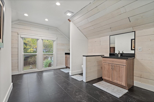 bar featuring lofted ceiling and wood walls