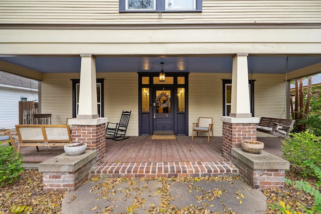 entrance to property featuring covered porch