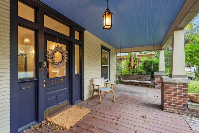 wooden terrace with a porch