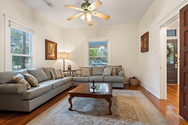 living room with hardwood / wood-style flooring, ceiling fan, and a healthy amount of sunlight