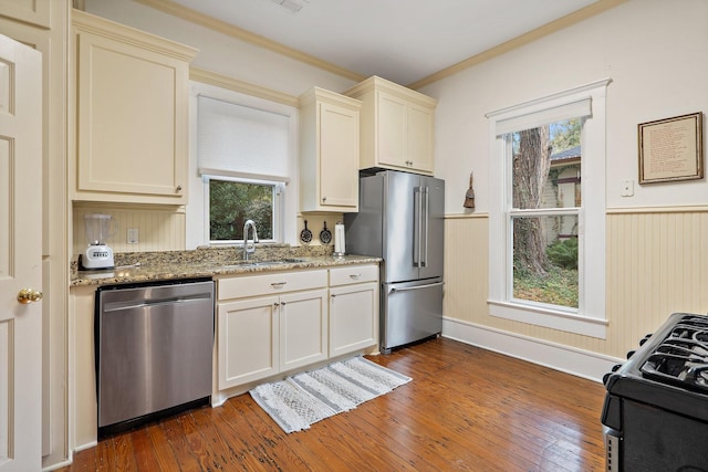 kitchen featuring plenty of natural light, stone countertops, and appliances with stainless steel finishes