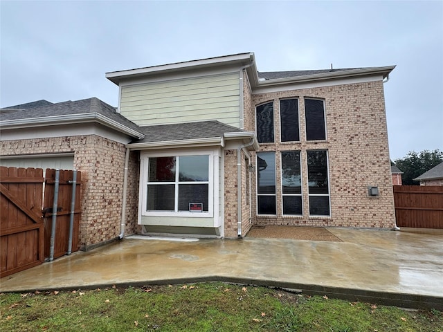 rear view of house with a patio