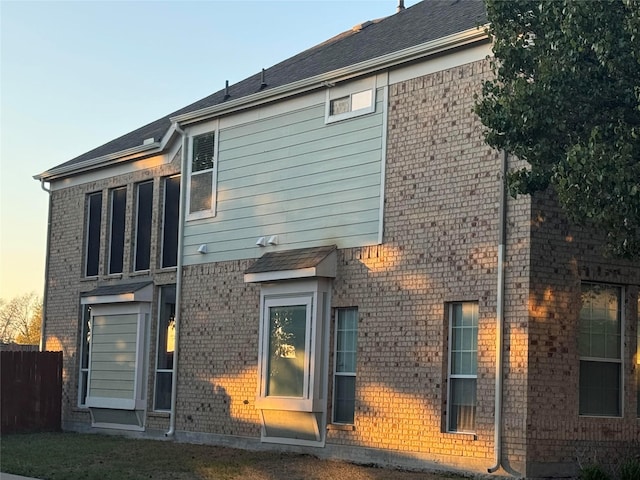 view of back house at dusk