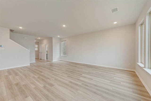 unfurnished living room featuring light hardwood / wood-style flooring