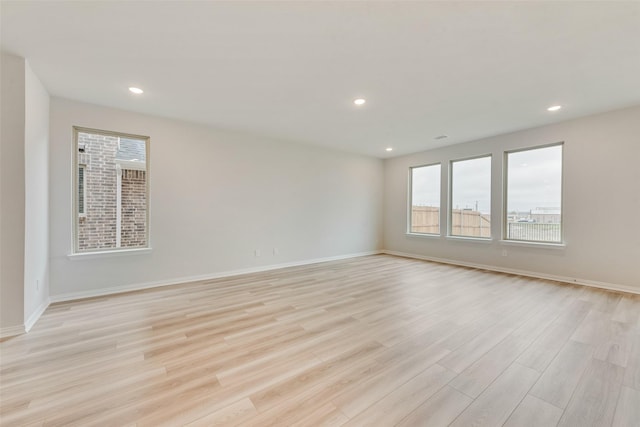 spare room featuring light hardwood / wood-style flooring