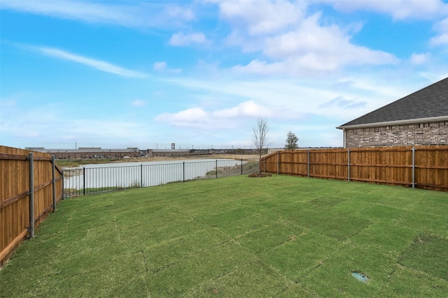 view of yard with a water view