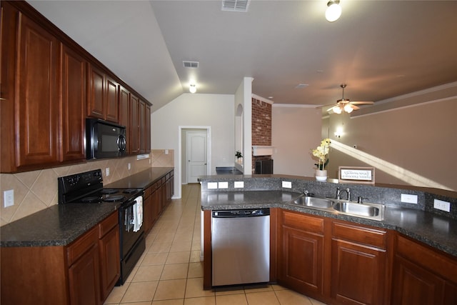 kitchen with tasteful backsplash, lofted ceiling, sink, light tile patterned floors, and black appliances