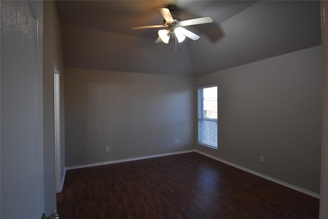 unfurnished room with lofted ceiling, dark hardwood / wood-style floors, and ceiling fan