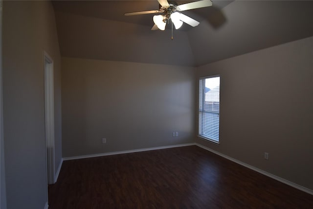 empty room featuring ceiling fan, lofted ceiling, and dark hardwood / wood-style flooring