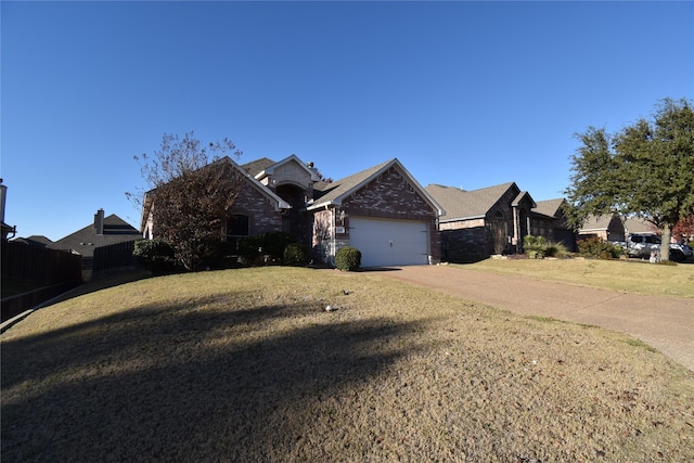 view of front of house with a garage and a front lawn