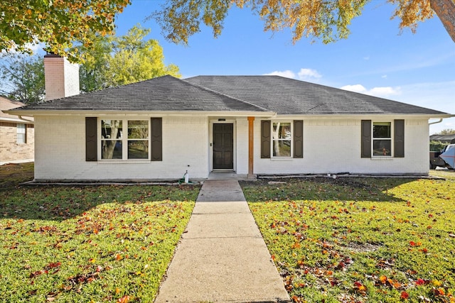 ranch-style house featuring a front lawn