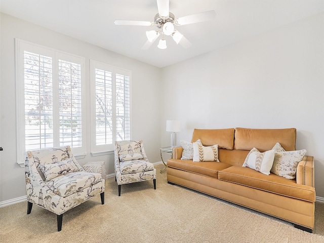 living room featuring carpet flooring and ceiling fan