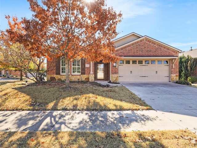 view of front of home featuring a front yard and a garage