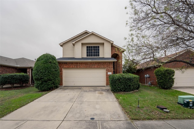 view of property featuring a garage and a front yard