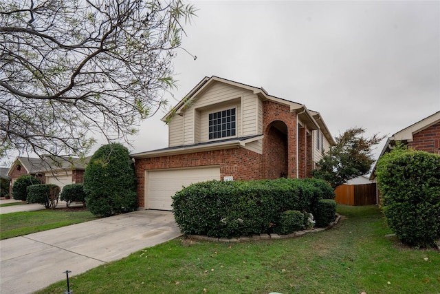 view of front of home with a front yard and a garage