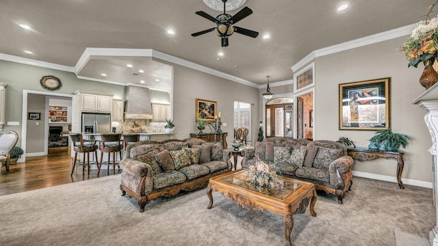 carpeted living room with crown molding and ceiling fan