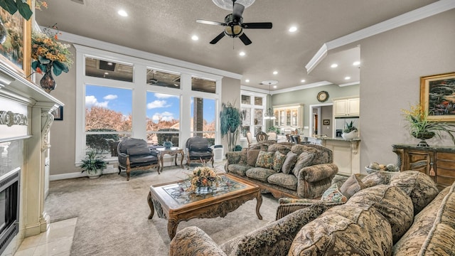 living room with a premium fireplace, ornamental molding, light carpet, and ceiling fan