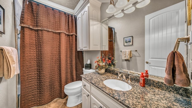 bathroom with vanity, toilet, and walk in shower