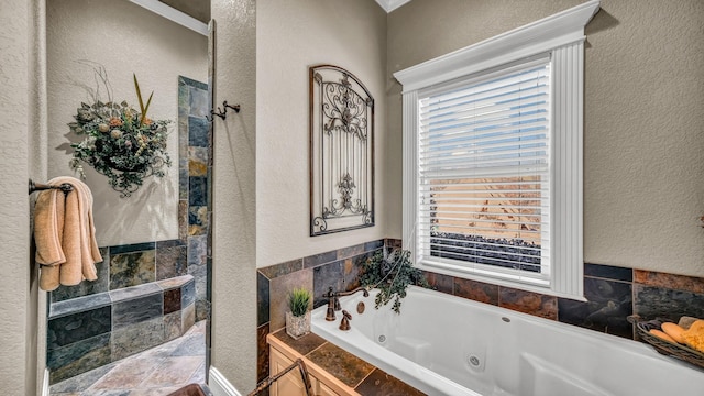 bathroom featuring independent shower and bath