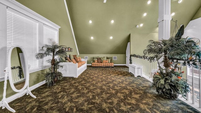 recreation room with lofted ceiling and dark colored carpet