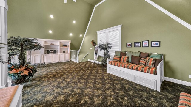 carpeted living room with high vaulted ceiling