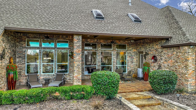 property entrance featuring ceiling fan and a patio