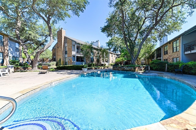 view of pool with a patio