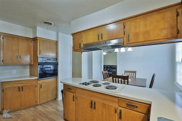 kitchen with ceiling fan, oven, light hardwood / wood-style floors, and white electric stovetop