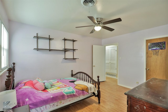 bedroom with ceiling fan and light hardwood / wood-style flooring