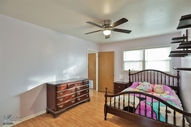 bedroom featuring ceiling fan and light hardwood / wood-style flooring