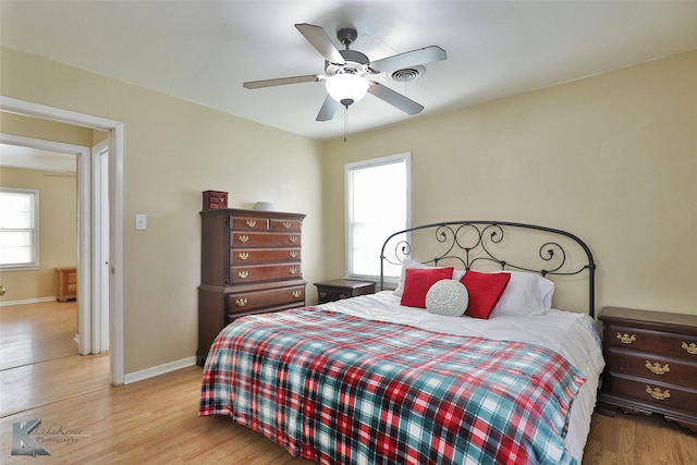 bedroom featuring ceiling fan and light hardwood / wood-style flooring