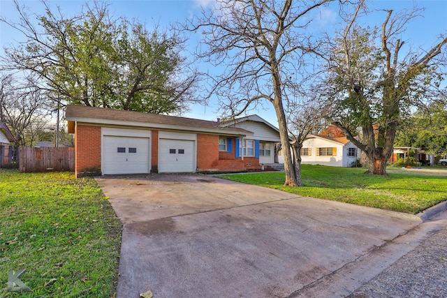 single story home with a garage and a front lawn