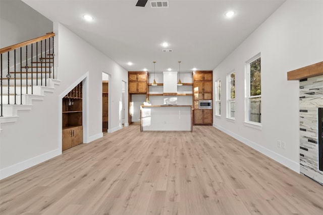 unfurnished living room featuring light hardwood / wood-style flooring