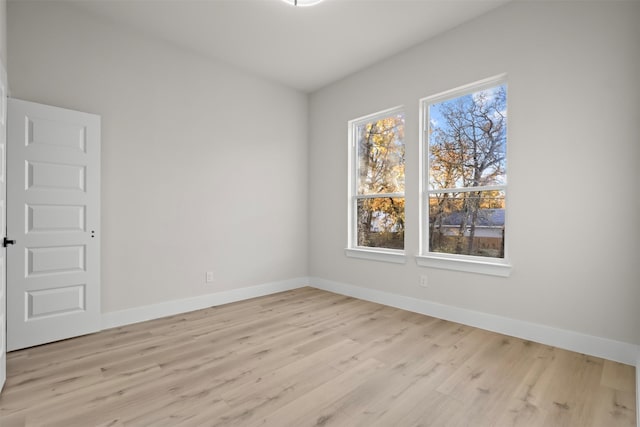 spare room featuring light wood-type flooring