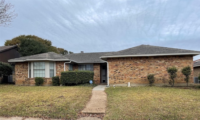 ranch-style home with a front lawn