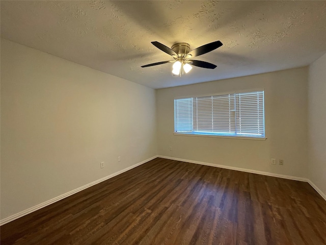 unfurnished room with dark hardwood / wood-style floors, ceiling fan, and a textured ceiling